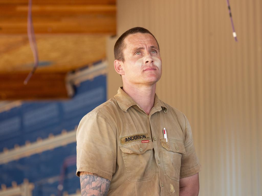 ADF sapper Selwyn Anderson stands under the roof of the independent Youth Centre he and his team have been working on. Picture: Floss Adams.
