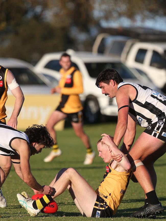 North Geelong's Osca Riccardi and Thomas Davis make life difficult for Bannockburn's Ryan Perkins. GDFNL North Geelong v Bannockburn. Picture: Alan Barber