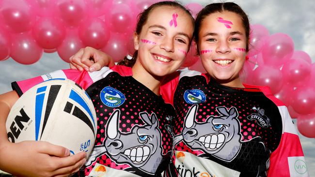 Rouse Hill Rhinos players Josephine Grima (11) and Ella Meredith (11) in their special pink jerseys for the club’s annual Pink Day fundraiser. Pictures: Angelo Velardo