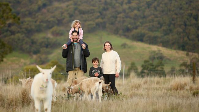 Sarah and Daniel Ajzner made a treechange from Melbourne to Macedon Ranges seven years ago to run Dreaming Goat Dairy, with their children, Gili, 3 and Avshi, 5. Picture: Andy Rogers