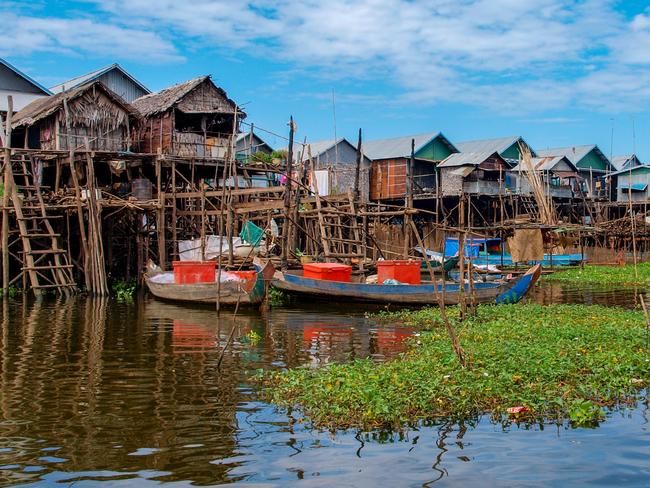 Simple bamboo houses built in the water of Tonle Sap Lake near Siem Reap in Cambodia. For T+L Aqua Expeditions story.