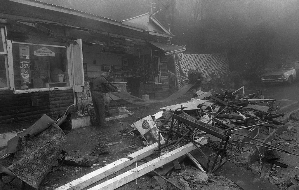 Historic: Toowoomba: Accidents: Clean up at the Log Cabin Service Station the morning after a semi-trailer rolled and crashed in the building removing most of the front of the station. The owner in 1978, Mr Neville Hammond started rebuilding immediately. Photo: Bruce Mackenzie / The Chronicle Neg: U875. Picture: Bruce Mackenzie