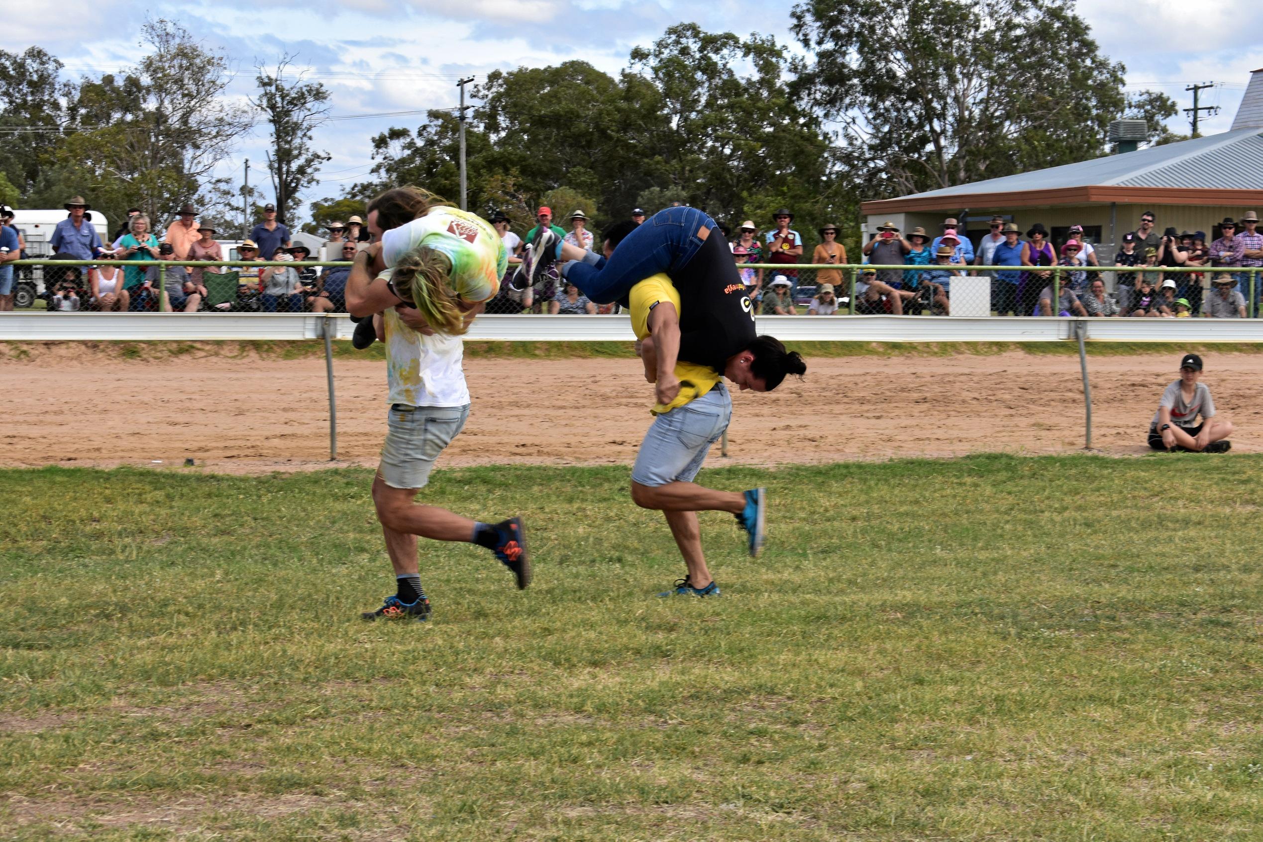 heat 1 of the wife carrying race in action