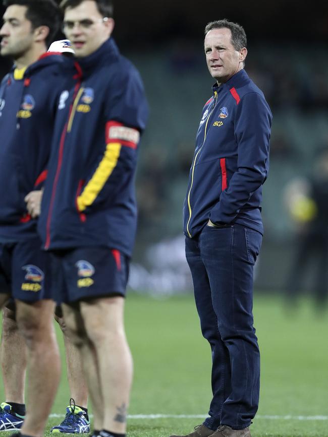 Crows AFL coach Don Pyke watches the players warm up before the SANFL Qualifying final between Adelaide and Port Adelaide on Saturday night. Picture: SARAH REED