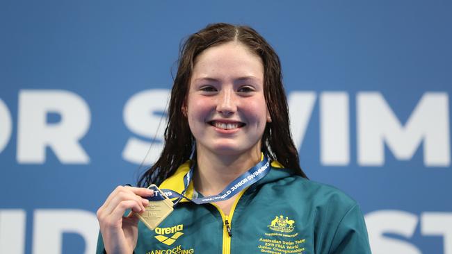 Eastern suburbs resident Bronte Job, a Jet swimming junior, with her world championship gold medal. (Photo by Ian MacNicol/Getty Images)