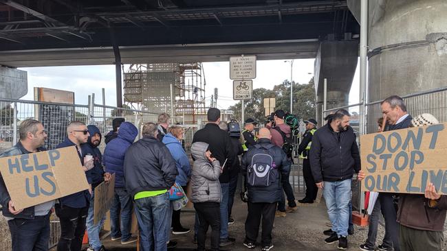 Protesters prepare to rally at at Reservoir level crossing. Picture: Richard Pearce