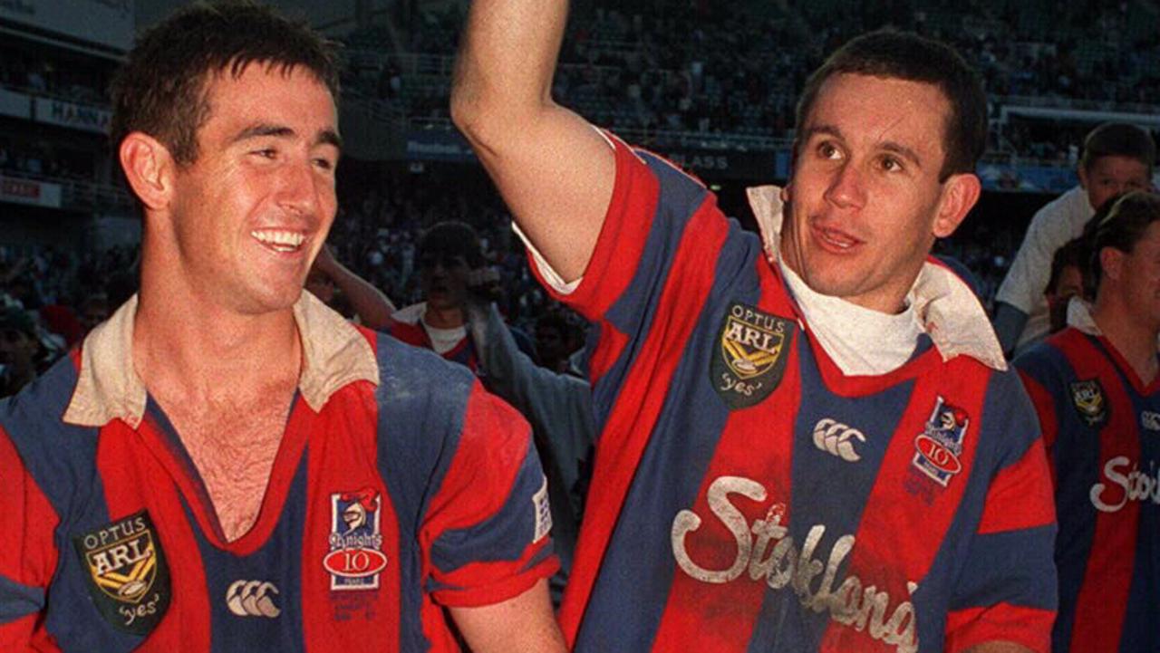 Brothers Andrew and Matthew Johns celebrate the 1997 grand final victory.