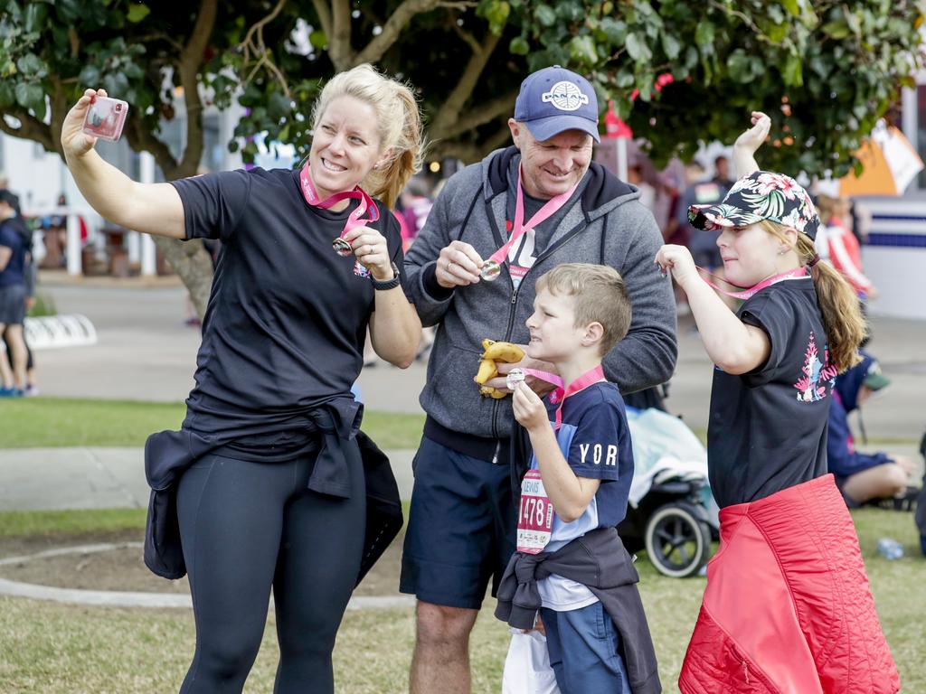 Kellie Harmon with husband James, Sophie, 10, and Lewis, 7, take a selfie at the finish of the Gold Coast Airport Fun Run. Picture: Tim Marsden.