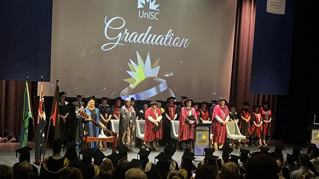 Graduates from the University of the Sunshine Coast's Fraser Coast campus celebrating at the Brolga Theatre.