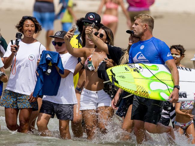 Mick Fanning, AUS, in action in round 1 of the Quiksilver Pro at Snapper. Mick celebrating his win with fans. Picture: Jerad Williams
