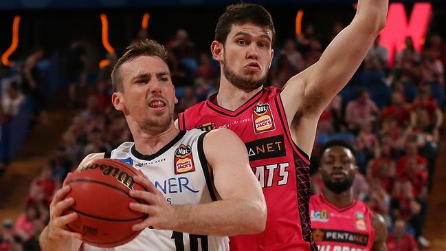 PERTH, AUSTRALIA — OCTOBER 27: Mitch McCarron of United drives to the basket against Clint Steindl of the Wildcats during the round three NBL match between the Perth Wildcats and Melbourne United at RAC Arena on October 27, 2018 in Perth, Australia. (Photo by Paul Kane/Getty Images)