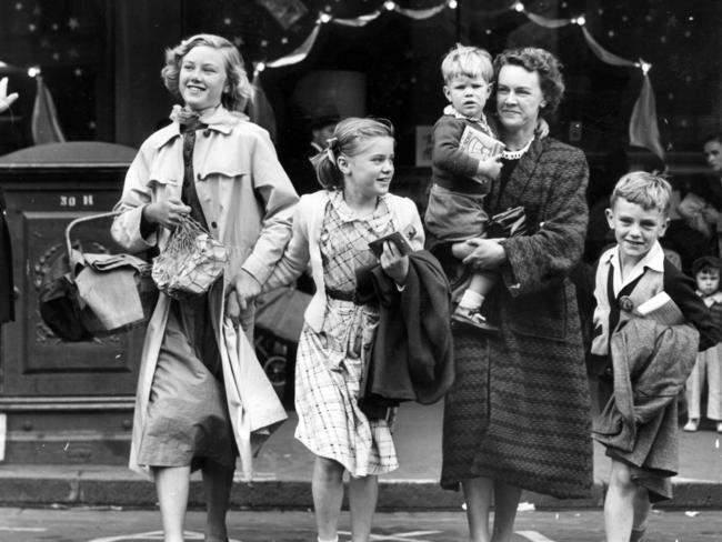 The Douglas family does their Christmas shopping in Bourke St in 1955.