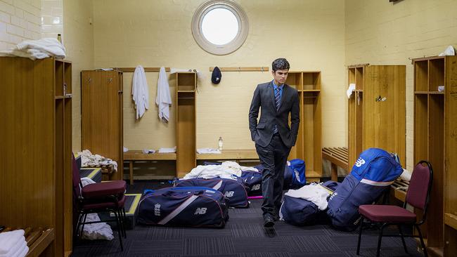 Arjun Tendulkar walks inside the away team dressing room at the SCG. Picture: Hamilton Lund.