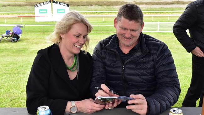 Hamilton Cup Races 2022 - Guests excited to place bets on a winning horse.