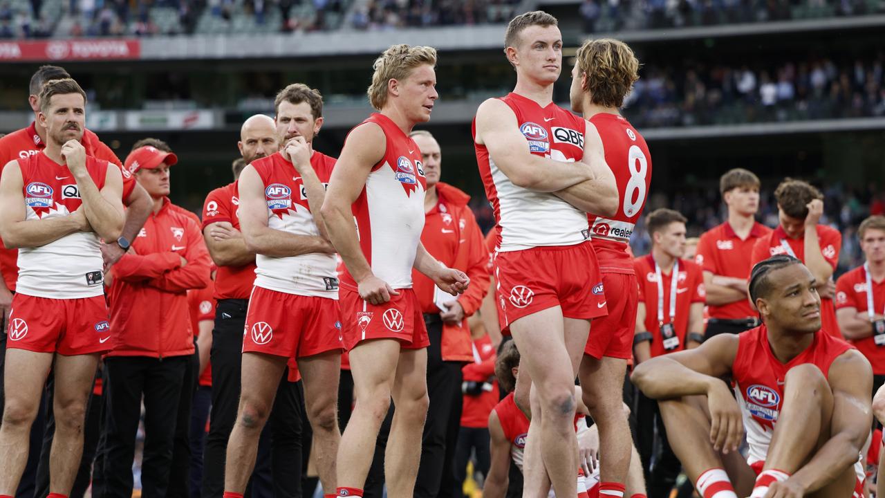 MELBOURNE, AUSTRALIA - SEPTEMBER 28: The Swans look dejected after the AFL Grand Final match between Sydney Swans and Brisbane Lions at Melbourne Cricket Ground, on September 28, 2024, in Melbourne, Australia. (Photo by Daniel Pockett/AFL Photos/Getty Images)