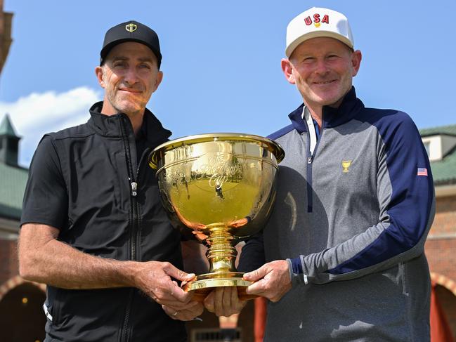 MEDINAH, ILLINOIS - APRIL 28: Team U.S.A. Captain, Brandt Snedeker, and Team International Captain, Geoff Ogilvy of Australia, hold the Presidents Cup together at Medinah Country Club on April 28, 2025, in Medinah, Illinois. (Photo by Ben Jared/PGA TOUR)