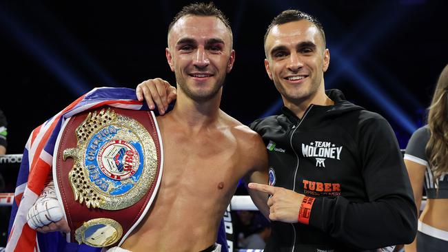 Jason Moloney (left) and twin brother Andrew Moloney celebrate after Jason’s victory over Vincent Astrolabio for the WBO bantamweight championship. Picture: Mikey Williams/Top Rank.