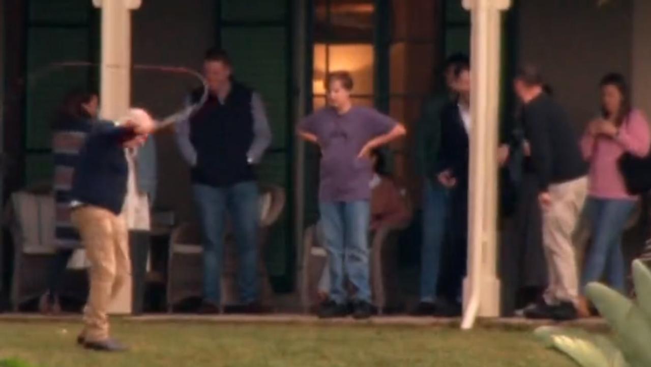 Mr Morrison was seen cracking a whip on the lawn. Picture: Channel 9