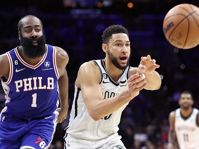 PHILADELPHIA, PENNSYLVANIA - JANUARY 25: Ben Simmons #10 of the Brooklyn Nets passes past James Harden #1 of the Philadelphia 76ers during the fourth quarter at Wells Fargo Center on January 25, 2023 in Philadelphia, Pennsylvania. NOTE TO USER: User expressly acknowledges and agrees that, by downloading and or using this photograph, User is consenting to the terms and conditions of the Getty Images License Agreement.   Tim Nwachukwu/Getty Images/AFP (Photo by Tim Nwachukwu / GETTY IMAGES NORTH AMERICA / Getty Images via AFP)