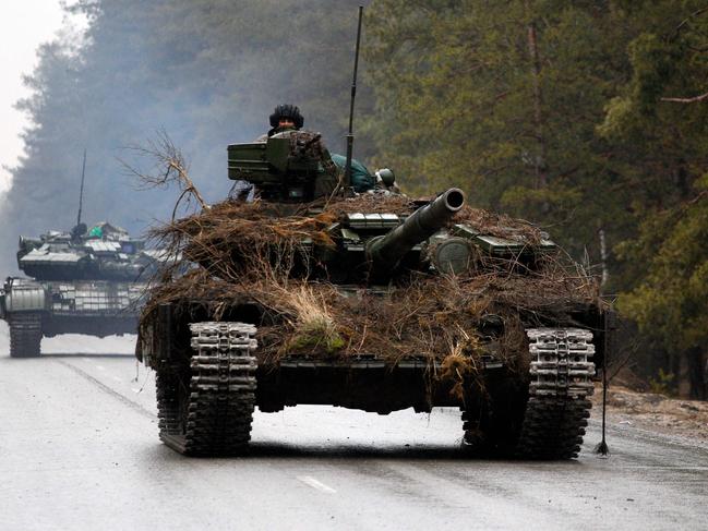 Ukrainian tanks move on a road before an attack in Lugansk region. Picture: AFP