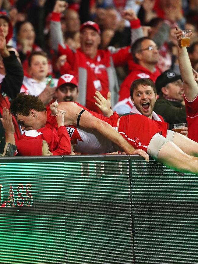 Rohan’s momentum carries him over the fence at the SCG. Picture: Phil Hillyard