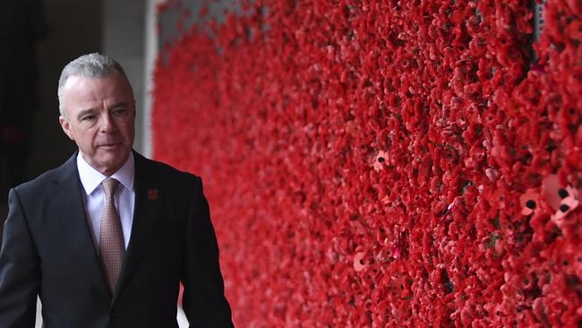 United States General (Retd) David H. Petraeus (left) is seen with Director of the Australian War Memorial Brendan Nelson as he inspects the Roll of Honour during a visit to the Australian War Memorial in Canberra, Tuesday, August 13, 2019. (AAP Image/Lukas Coch) NO ARCHIVING