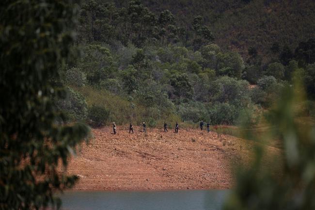 Police have used sniffer dogs and a drone to search the reservoir banks