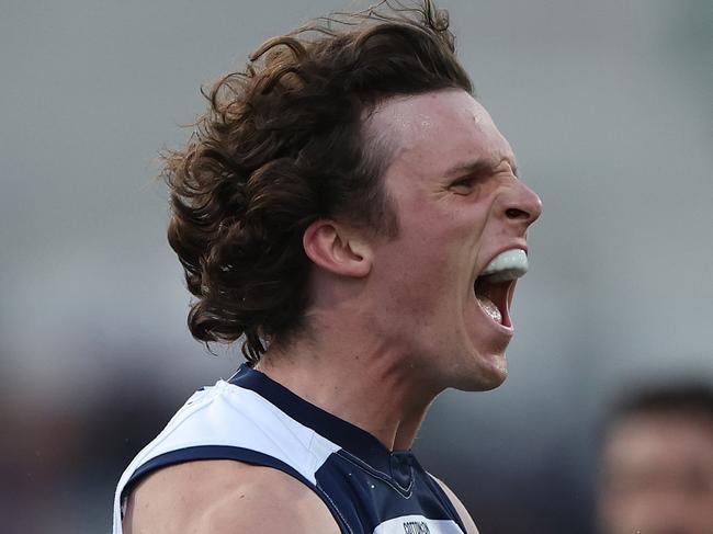 GEELONG, AUSTRALIA - MAY 06: Max Holmes of the Cats celebrates after scoring a goal during the round eight AFL match between Geelong Cats and Adelaide Crows at GMHBA Stadium, on May 06, 2023, in Geelong, Australia. (Photo by Robert Cianflone/Getty Images)