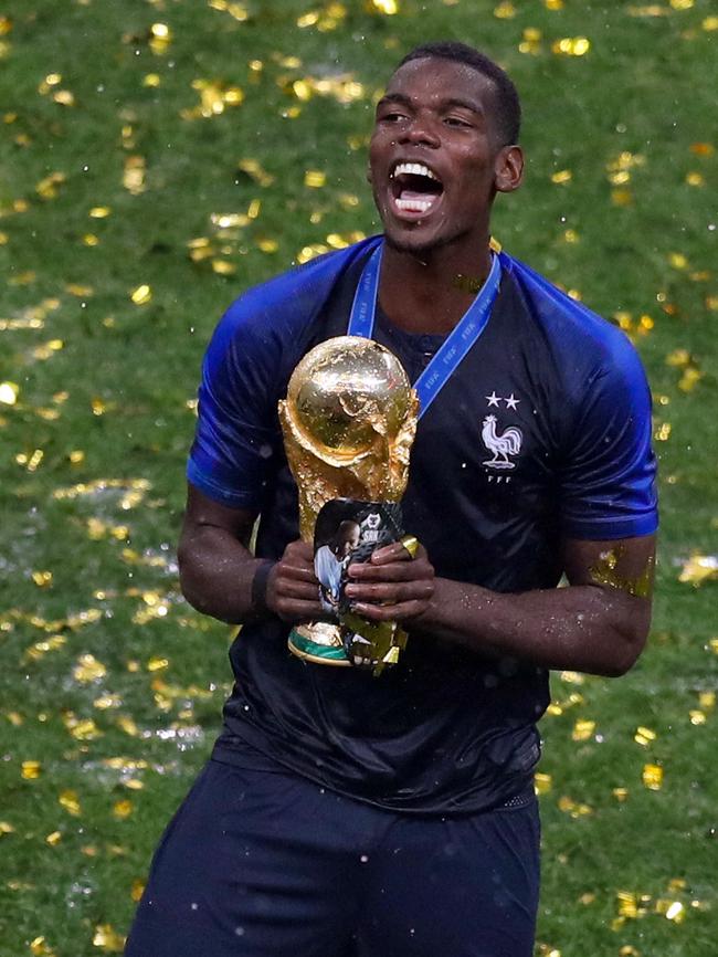 Paul Pogba of France celebrates with the trophy after the 2018 FIFA World Cup Final. Photo by Catherine Ivill/Getty Images.