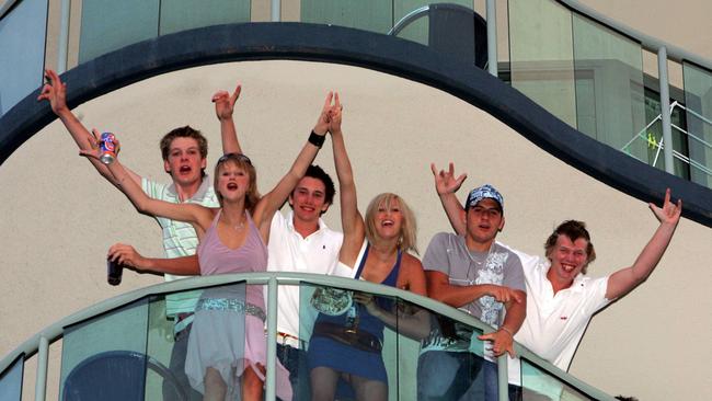 Revellers on the balcony of an apartment building on The Esplanade at Mooloolaba celebrate New Year’s Eve in 2004. Picture: Bruce Long