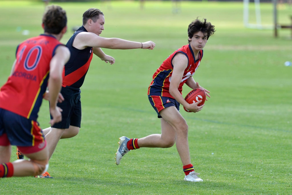 Ahmad Vosmer-Iqbal of Concordia looks for options against Laidley State High School in AFL Queensland Schools Cup Darling Downs round at Captain Cook ovals, Friday, April 27, 2018. Picture: Kevin Farmer