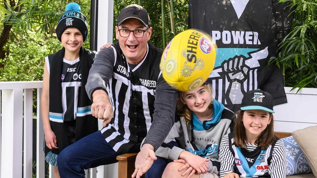 ***Embargoed for SA WEEKEND***Port Adelaide Football Club president David Koch with his grandchildren.Matilda 13yrs (footy scarf), Oscar 11yrs, Lila 8yrs.Kochie hasn't been to a game this year because he can't get out of Sydney because of COVID.PictureÃs Darren Leigh Roberts