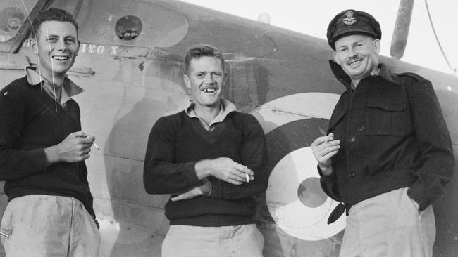 Flight Lieutenant John Jackson, right, with ground crew leading aircraftman R. Dunning and J. Morvell. Picture: Australian War Memorial