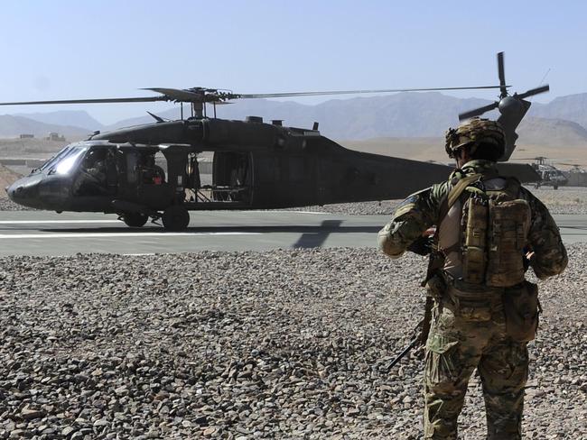 Photograph by: Corporal Raymond VanceCaption: Australian Special Operations Task Group Soldiers move towards waiting UH-60 Blackhawk helicopters as part of the Shah Wali Kot Offensive.Mid Caption: Shah Wali Kot Offensive Afghan National Security Forces (ANSF) partnered with Australian Special Forces from the Special Operations Task Group conducted a deliberate operation to clear a Taliban insurgent stronghold in the Shah Wali Kot region of northern Kandahar province.The Shah Wali Kot Offensive comprised synchronised and deliberate clearance operations involving Australian Commandos combined with a number of surgical helicopter-born assaults from Special Air Service (SAS) troops on key targets.Removing Taliban insurgents from Afghan communities allows the Government of Afghanistan to establish a presence and gain the trust of the community to provide them with necessary infrastructure and security that was not provided by the insurgents.The Shah Wali Kot Offensive was part of Australia   s contribution to Operation Hamkari, the Coalition operation to extend the Government of Afghanistan   s influence into Kandahar City.