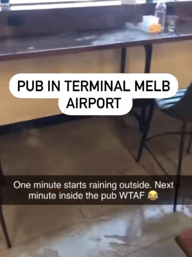 Water floods through the roof of a Terminal 1 pub at Melbourne Airport. Picture: Jacqui Felgate