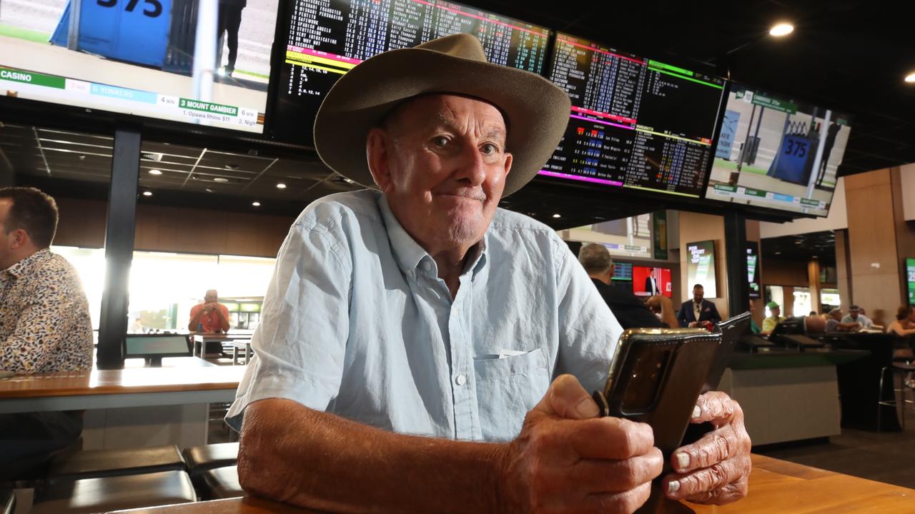 Doug Oldfield from Sydney studies the field in the betting ring. Picture Glenn Hampson