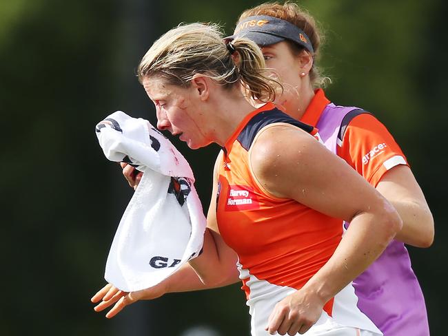 Cora Staunton of GWS comes off with a facial injury after trying to tackle Sophie Casey of the Magpies. Picture: Getty Images