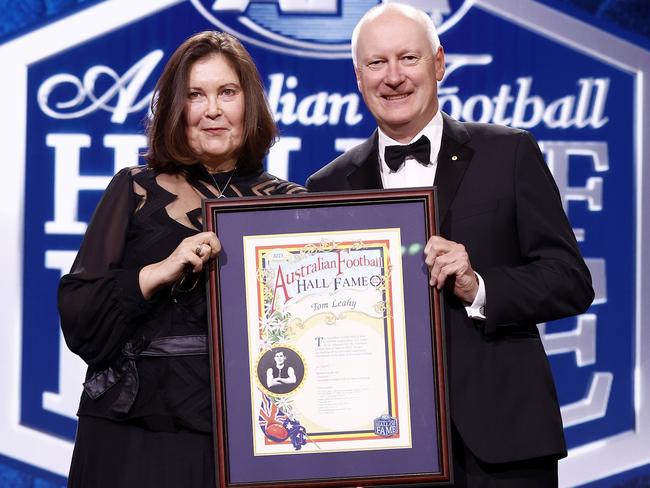 Richard Goyder with Christine Cornish who is presented on behalf of Hall of Fame inductee Tom Leahy. (Photo by Michael Willson/AFL Photos/via Getty Images)