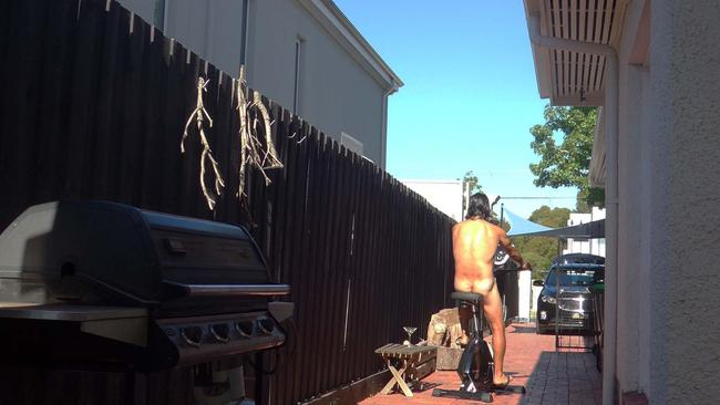 Mr Penlidis riding his exercise bike naked, in full view from the neighbour’s windows.