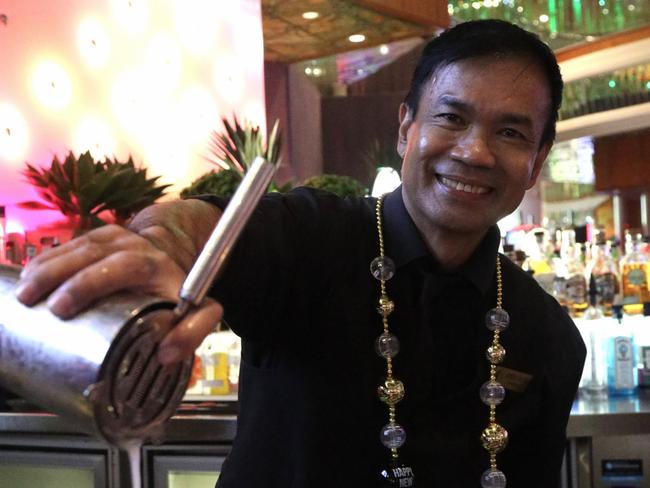 Pullman Reef Casino bar supervisor Eddie Valdez prepares festive cocktails ahead of the venues New Years Eve celebrations on Tuesday night. Photo: Catherine Duffy.