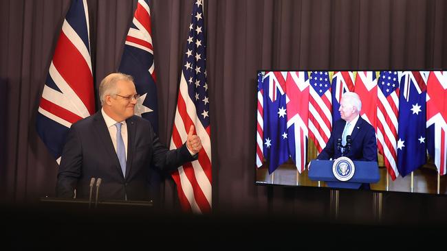 Scott Morrison announcing the AUKUS alliance with Joe Biden via video conference, in Parliament House, in 2021. Picture: Newswire/Gary Ramage