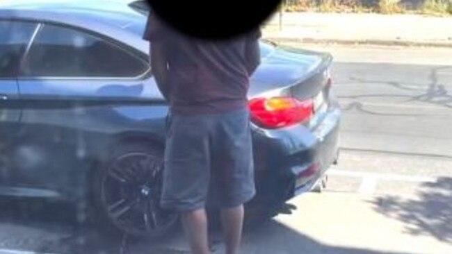 A man caught urinating on a stranger's car in Melbourne. Image source: Instagram/leoalhalabi