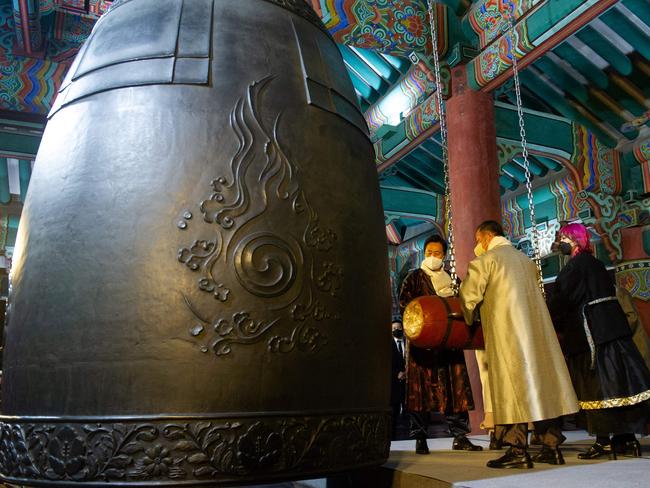 An image provided by Seoul Metropolitan Government shows Seoul Mayor Oh Se-hoon and other participants hitting a bell to welcome the New Year during a pre-recording broadcast in South Korea.