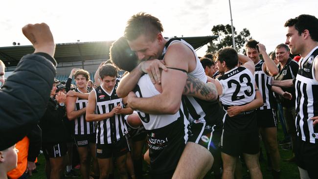 North Haven player Jack Howden holds teammate Matthew Reed after winning the division four grand final over Morphettville Park in 2017. Picture: AAP/Morgan Sette