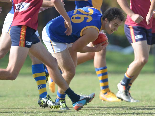 Brendan Close works his way through traffic for De La Salle. Picture: Susan Windmiller