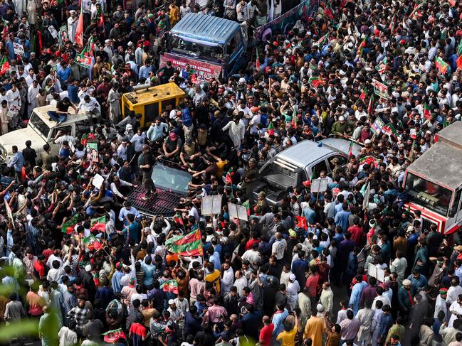 PTI activists gather around Khan’s vehicle during a rally on May 1. Picture: Arif Ali/AFP