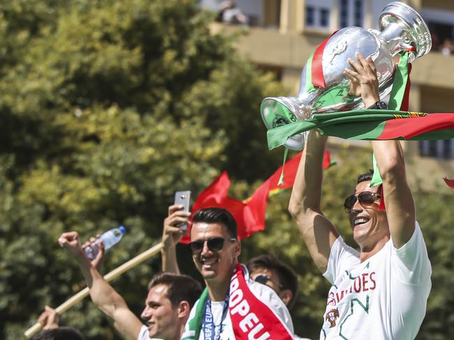 Ronaldo raises the 2016 Euro Cup in post-match celebrations.