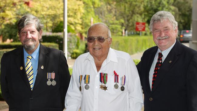 Paul Bryant (Fairfield RSL), World War II veteran Cecil Boland, 91, an Fairfield Hospital general manager Arnold Tammekand. Picture: Tim Clapin.
