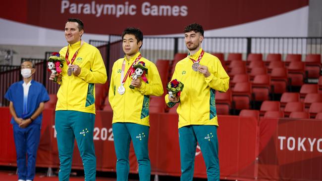 Australia’s Joel Coughlan, Lin Ma and Nathan Pellissier celebrate their silver medal in the men's table tennis team classes 9-10 at the Paralympic Games in Tokyo. (Photo by Tasos Katopodis/Getty Images)