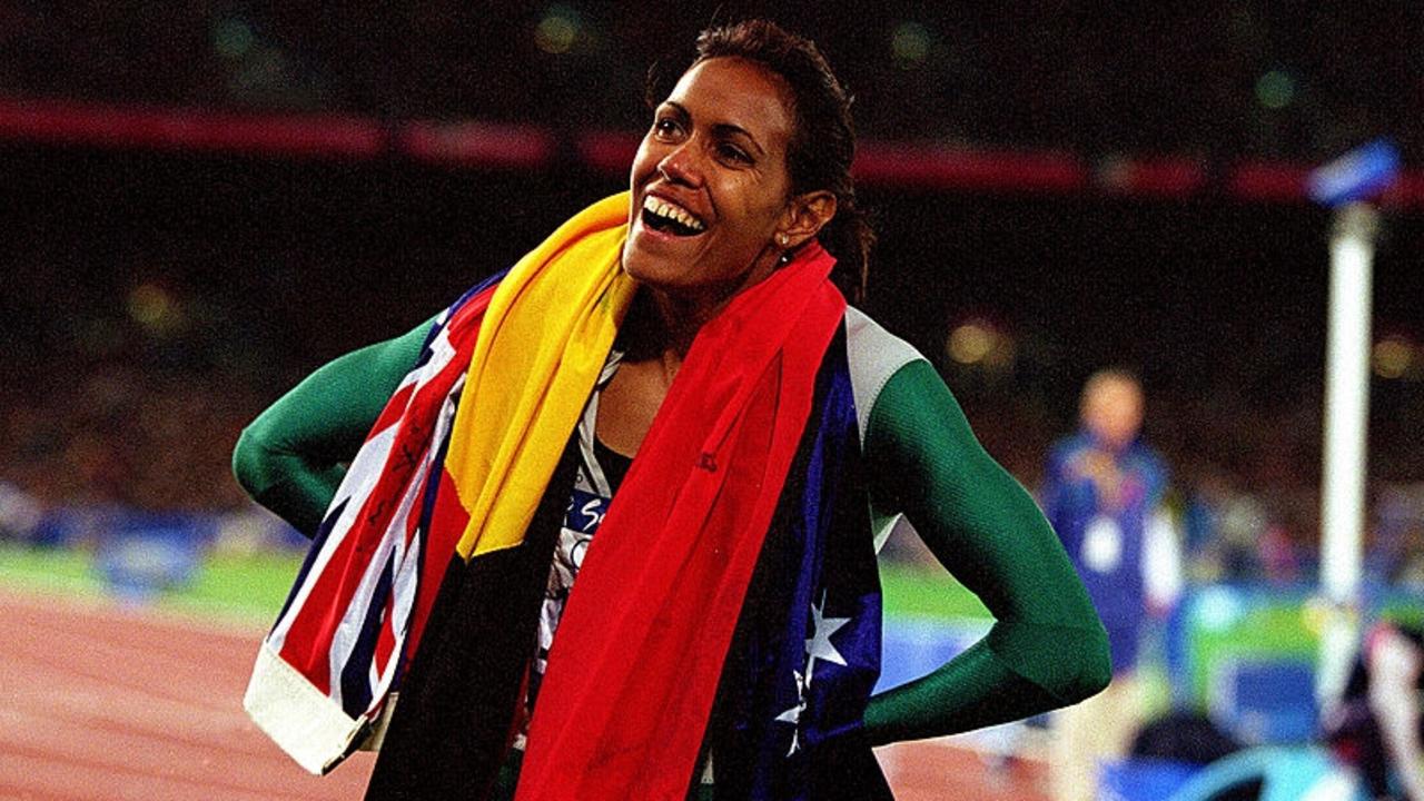 25 Sep 2000: Cathy Freeman of Australia celebrates after winning gold in the Women's 400m final held at Olympic Stadium during the Sydney 2000 Olympic Games, Sydney, Australia. Mandatory Credit: Nick Wilson/ALLSPORT